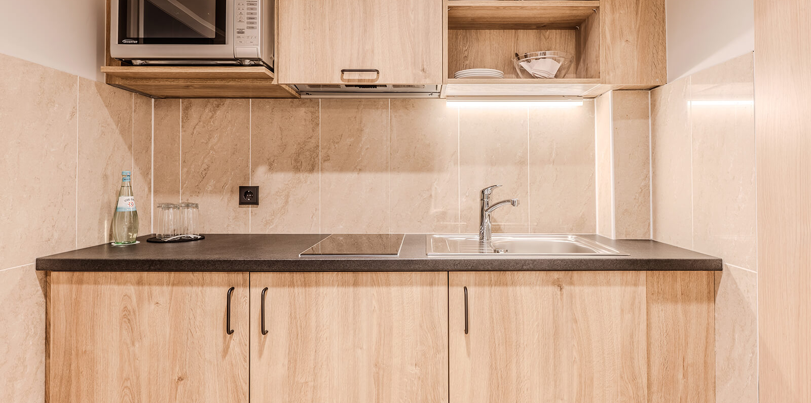 AH Deluxe Family Room with sliding doors and kitchen